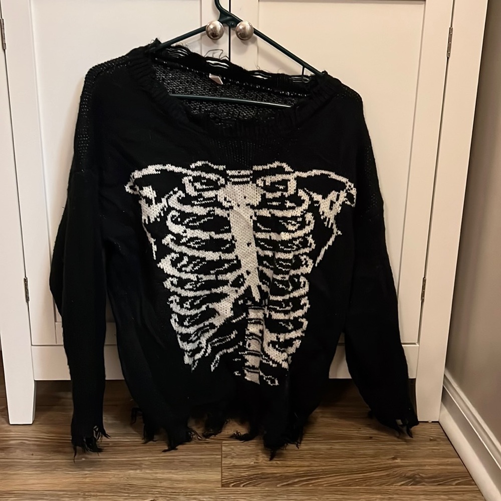Distressed skeleton sweater